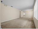 Spacious living room with neutral carpeting at 319 Sand Ridge Dr, Davenport, FL 33896