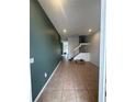Bright and spacious entryway with tile flooring and staircase at 3459 Allegra Cir, St Cloud, FL 34772