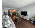 Cozy living room with modern furniture, open layout, and seamlessly connects to the dining area at 4575 S Texas Ave # 207, Orlando, FL 32839