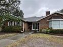 Brick home with mature landscaping and a walkway to the entrance at 5030 Haywood Ruffin Rd, St Cloud, FL 34771