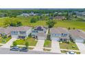 Neighborhood view showcasing several two-story houses at 5283 Bracks Landing Dr Dr, St Cloud, FL 34771