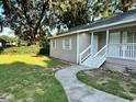 House exterior, walkway, and grassy yard at 5920 Nw 65Th St, Ocala, FL 34482
