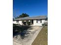 Front view of a single-story house with a driveway and lawn at 618 Jupiter Way, Casselberry, FL 32707