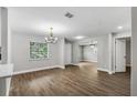 Spacious dining area with hardwood floors and a chandelier at 8607 Tarragon Dr, Orlando, FL 32825
