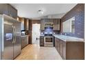 Modern kitchen with stainless steel appliances and granite countertops at 110 Talavera Ln, Kissimmee, FL 34758