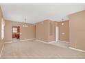 Large living room with neutral walls and carpeted floors at 223 Largovista Dr, Oakland, FL 34787