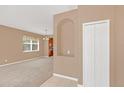 Spacious living room with neutral carpeting and an open floor plan at 223 Largovista Dr, Oakland, FL 34787