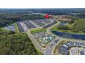 Aerial view showcasing community amenities and townhome location at 2381 Reading Trl, Kissimmee, FL 34746