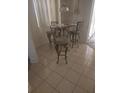 Small breakfast nook with a glass-top table and four chairs at 2889 Paige Dr, Kissimmee, FL 34741