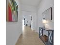Bright and airy entryway with tile flooring and a view of the living room at 3055 Prospect Trl, St Cloud, FL 34771