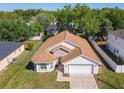 Well-maintained single Gathering home with a large yard, mature trees, and fenced perimeter at 438 Jay Ct, Kissimmee, FL 34759