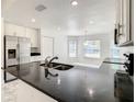 Modern kitchen featuring stainless steel appliances, sleek countertops, and ample cabinet space at 438 Jay Ct, Kissimmee, FL 34759