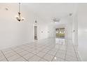 Bright living room with tile floors and sliding glass doors at 511 Cardinal Dr, Kissimmee, FL 34759