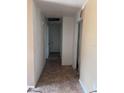 Hallway with tile flooring leading to bedrooms and bathrooms at 589 Duncan E Cir, Auburndale, FL 33823
