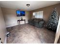 Comfortable living room with tile floors, couch and mounted TV at 589 Duncan E Cir, Auburndale, FL 33823
