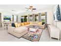 Spacious living room featuring a large sectional sofa and stylish decor at 7638 Oakmoss Loop, Davenport, FL 33837