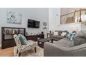 Bright and airy living room with ample seating and a high ceiling at 2243 Wyndham Palms Way, Kissimmee, FL 34747