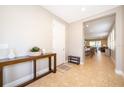 Bright entryway with console table and view into the living area at 250 Pendant Ct, Kissimmee, FL 34747