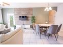 Bright dining area with round table and gray chairs at 2774 Almaton Loop # 305, Kissimmee, FL 34747