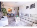 Open living and dining area with modern furniture and decor at 2774 Almaton Loop # 305, Kissimmee, FL 34747