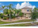 Two-story house with a large backyard and palm trees at 4010 Navigator Way, Kissimmee, FL 34746