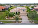 Two-story house with a large backyard and a lake view at 4010 Navigator Way, Kissimmee, FL 34746