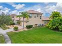 Two-story house with a large backyard and palm trees at 4010 Navigator Way, Kissimmee, FL 34746