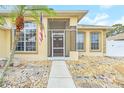 Front entry with double doors and screened porch at 4878 Zion Dr, St Cloud, FL 34772
