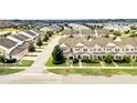 Townhome community with numerous houses and landscaping at 6530 Stoller Ave, Windermere, FL 34786