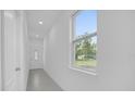 Bright entryway with tiled floor and view to backyard at 661 Lincoln St, Kissimmee, FL 34741