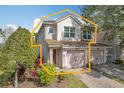 Two-story townhome with two-car garage and nicely landscaped front yard at 8318 Quimby Cir, Davenport, FL 33896