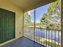 Screened balcony overlooking a tranquil lake at 8803 Dunes Ct # 306, Kissimmee, FL 34747