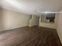 Open-concept living room with modern hard flooring and natural light at 10583 Regent Square Dr # 1206, Orlando, FL 32825