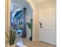 Bright and airy entryway with a view into the living room at 1188 Anne Elisa Cir, St Cloud, FL 34772