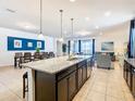 Spacious kitchen with an island and granite countertops at 1610 Lima Ave, Kissimmee, FL 34747