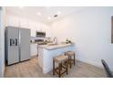 Modern kitchen with stainless steel appliances and granite countertops at 1813 Coriander Dr, Kissimmee, FL 34759