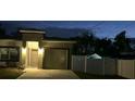 Modern home featuring an attached garage, neatly landscaped front yard, and neutral color palette at 19 James Ct, Davenport, FL 33837