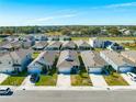 Aerial perspective of the community featuring well-maintained homes and landscaping at 2265 Tay Wes Dr, St Cloud, FL 34771
