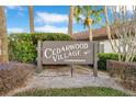 Cedarwood Village Condominiums sign, welcoming residents and guests at 2394 Sun Valley Cir # 2394, Winter Park, FL 32792