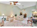 Open living area with vaulted ceiling and ample natural light at 2394 Sun Valley Cir # 2394, Winter Park, FL 32792