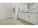 Bathroom with granite vanity and walk-in shower at 286 Begonia Ln, Kissimmee, FL 34759