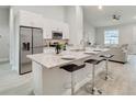 Modern kitchen with granite island and stainless steel appliances at 286 Begonia Ln, Kissimmee, FL 34759