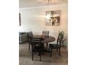 Bright dining area featuring a round table and four chairs at 3719 Conroy Rd # 2023, Orlando, FL 32839