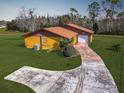 Single story home, spacious backyard, and a long driveway at 713 Green Ct, Kissimmee, FL 34759