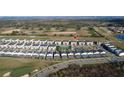 Aerial view of the community highlighting the neighborhood, landscaping, and golf course at 853 Ocean Course Ave # 853, Davenport, FL 33896