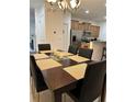 Dining room features a large table with seating for six at 8968 California Palm Rd, Kissimmee, FL 34747