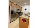 Modern kitchen with stainless steel appliances and granite countertops at 8968 California Palm Rd, Kissimmee, FL 34747