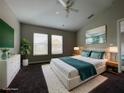 Bright and airy main bedroom with plush bedding and large windows at 10238 Cala Lily Trl # S, Orlando, FL 32832