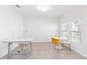 Bright home office with natural light, tile flooring, and contemporary furniture at 1813 Castleton Dr, St Cloud, FL 34771