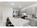 Bright kitchen boasting stainless steel appliances, and a large island with barstool seating at 2352 Tay Wes Dr, St Cloud, FL 34771